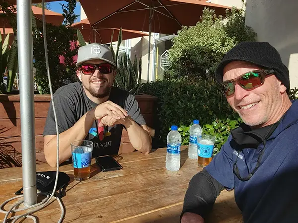 jason and son hot tub repair in san diego sitting at table eating lunch
