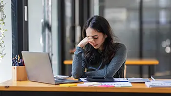 women-stressed-at-work-sitting-at-desk-due-to-hot-tub-needing-repair-for-stress-relief-in-san-diego women stressed out at work sitting at desk due to needing hot tub repair for stress relief in San Diego